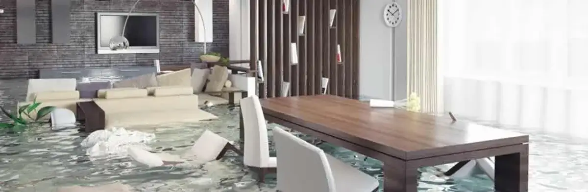 home interior affected by water damage with flooded floors and displaced furniture in Dallas, TX